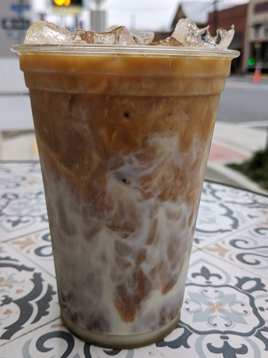 Iced coffee on a patterned table