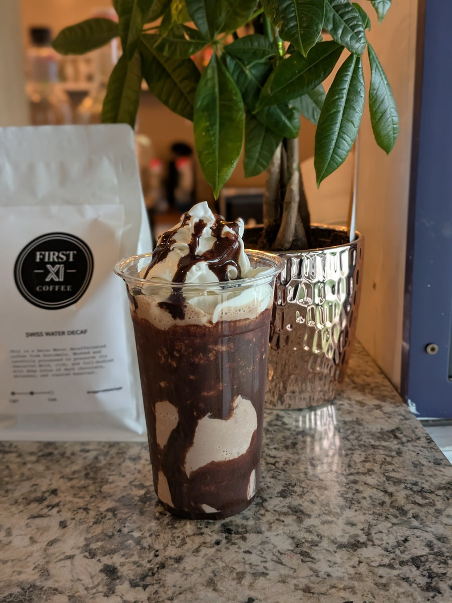 Chocolate drink topped with whipped cream